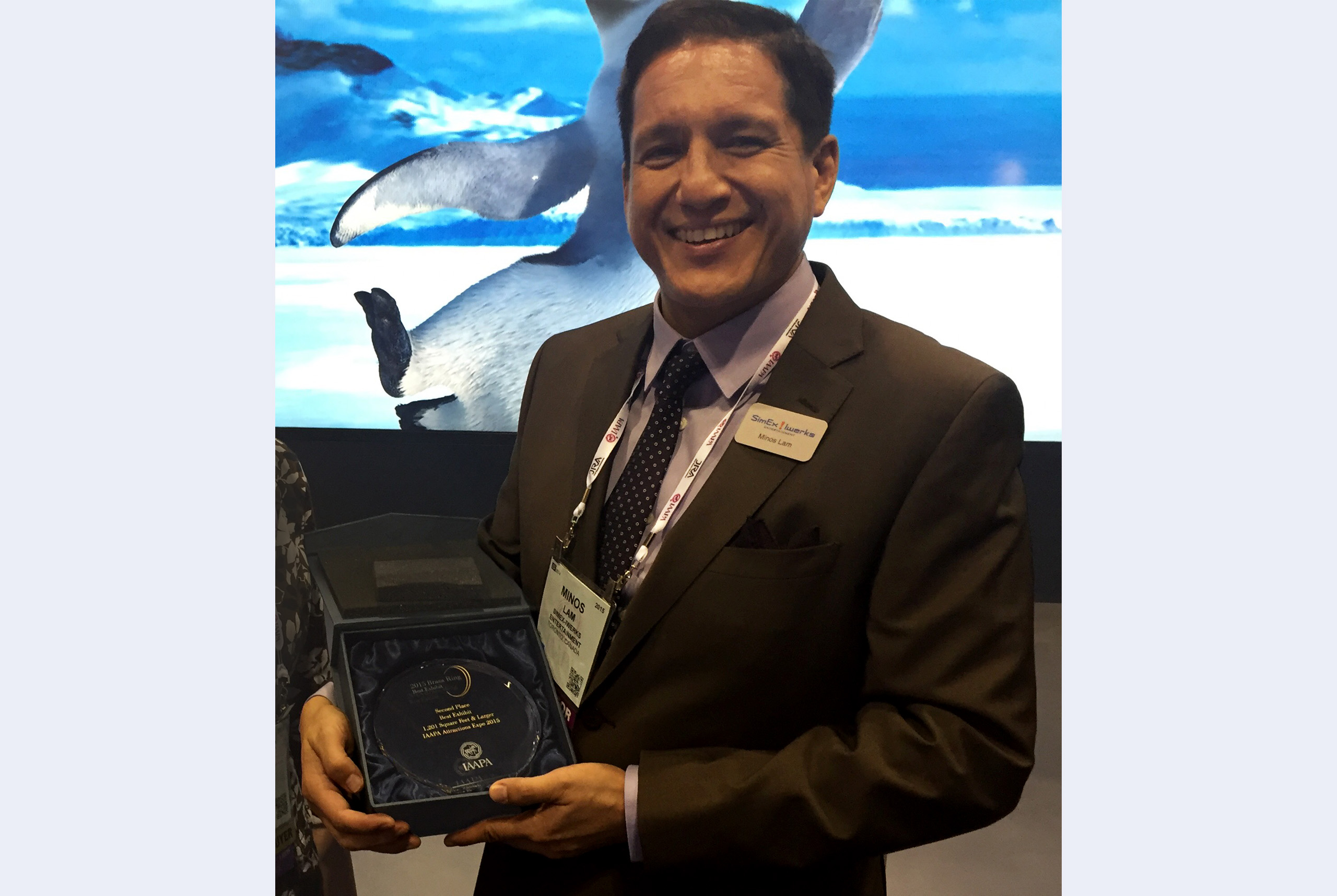 Minos Lam receives an award